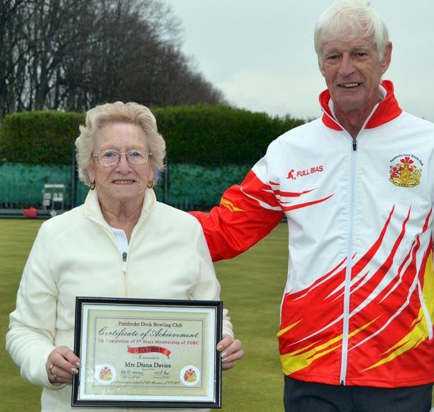 Diana Davies receives certificate to mark her 50 years membership